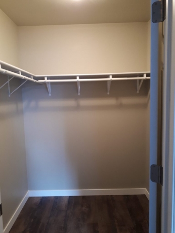 Rental unit master bedroom walk-in closet